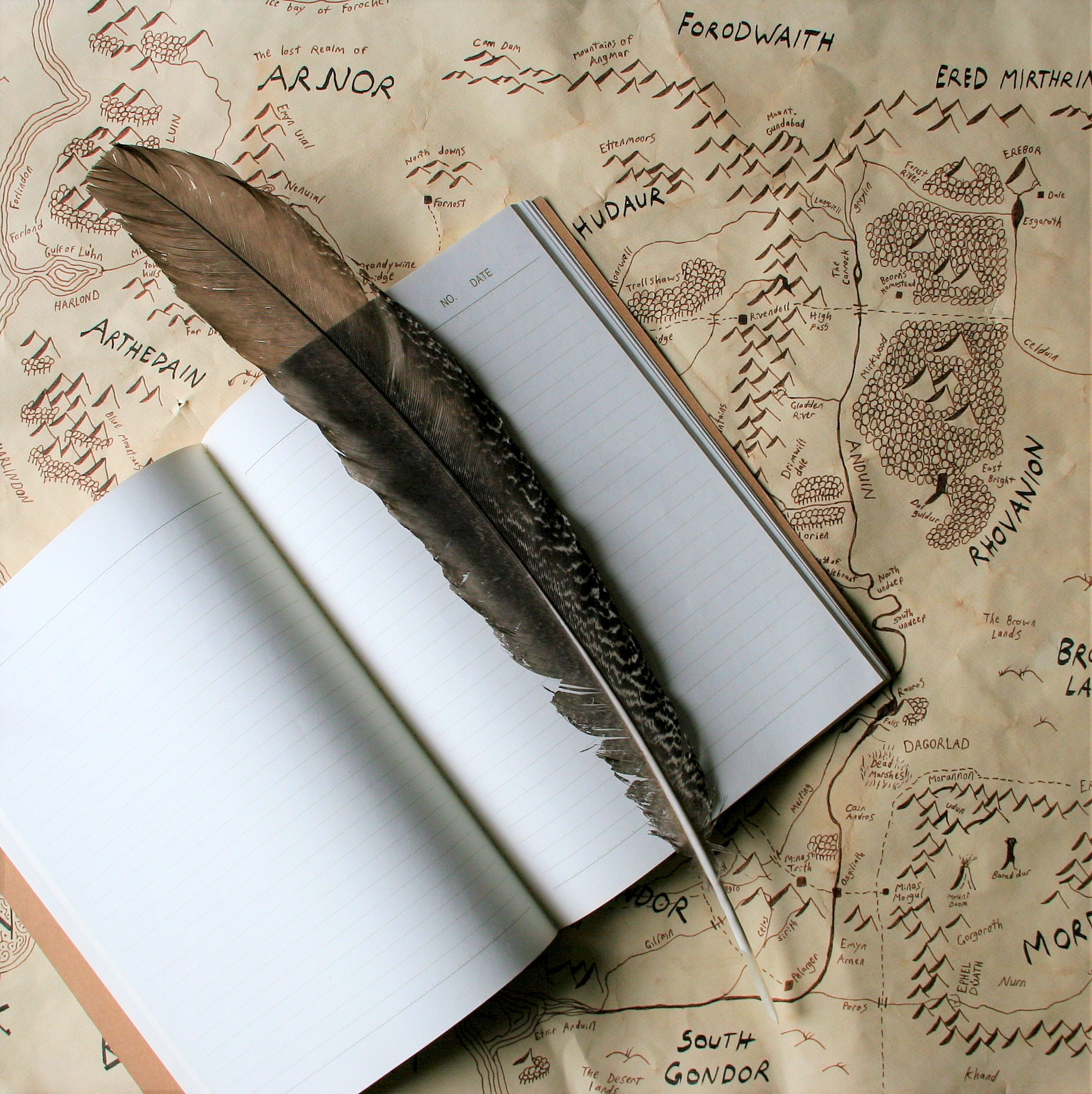 Notebook, Quill, and Map